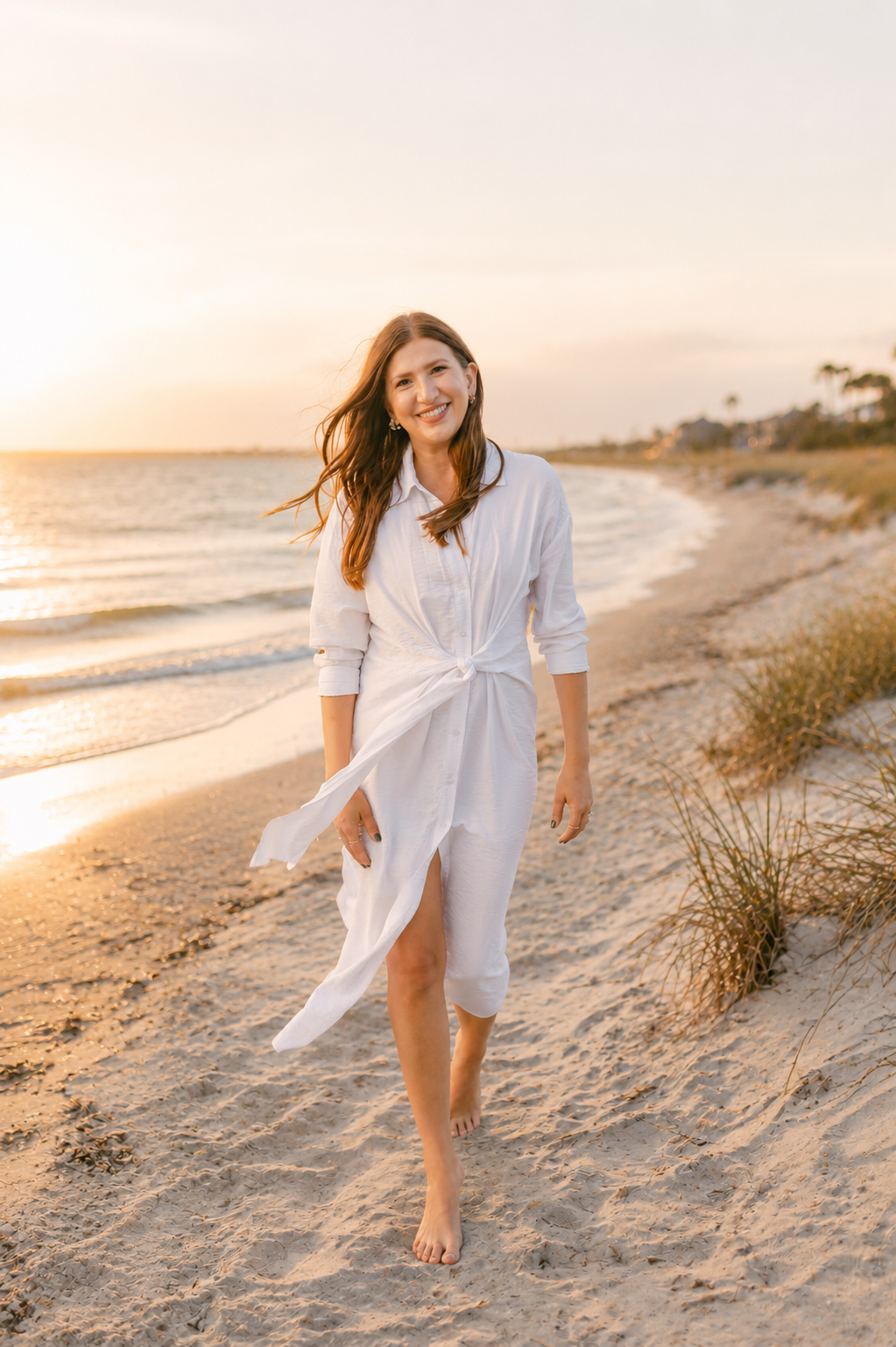 Alena Goncharov, Charleston luxury real estate advisor, on the beach at sunset